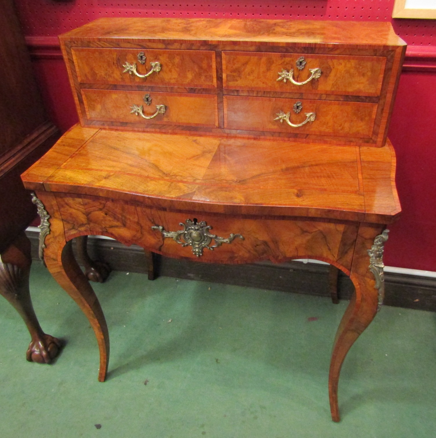 A burr walnut French style ladies writing desk with tulip wood inlay, brush slide and single drawer,