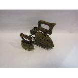 Two Victorian cast iron flat irons on stands including Kenrick