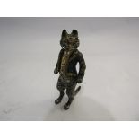 A cold painted bronze figure of a cat wearing a jacket,