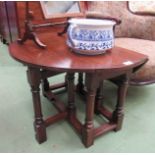 An 18th Century style oak gate-leg occasional table,