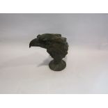 A cast bust figure of an eagle head,