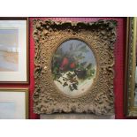 A gilt framed oil on canvas of a robin and other bird amongst holly in the snow,