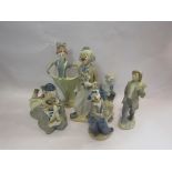 A quantity of Nao and Cascades porcelain figures of clowns, etc.