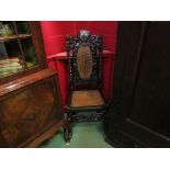 A Charles II walnut bergère chair with carved acanthus leaf and cherub decoration,