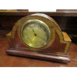 A mahogany inlaid mantel clock