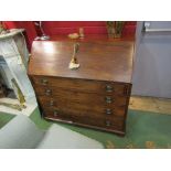 A George III mahogany writing bureau the inlaid satinwood fitted interior of eight drawers,