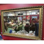 A gilt framed wall mirror,