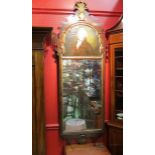 A George III pier mirror with portrait above and feathered helmet crest,