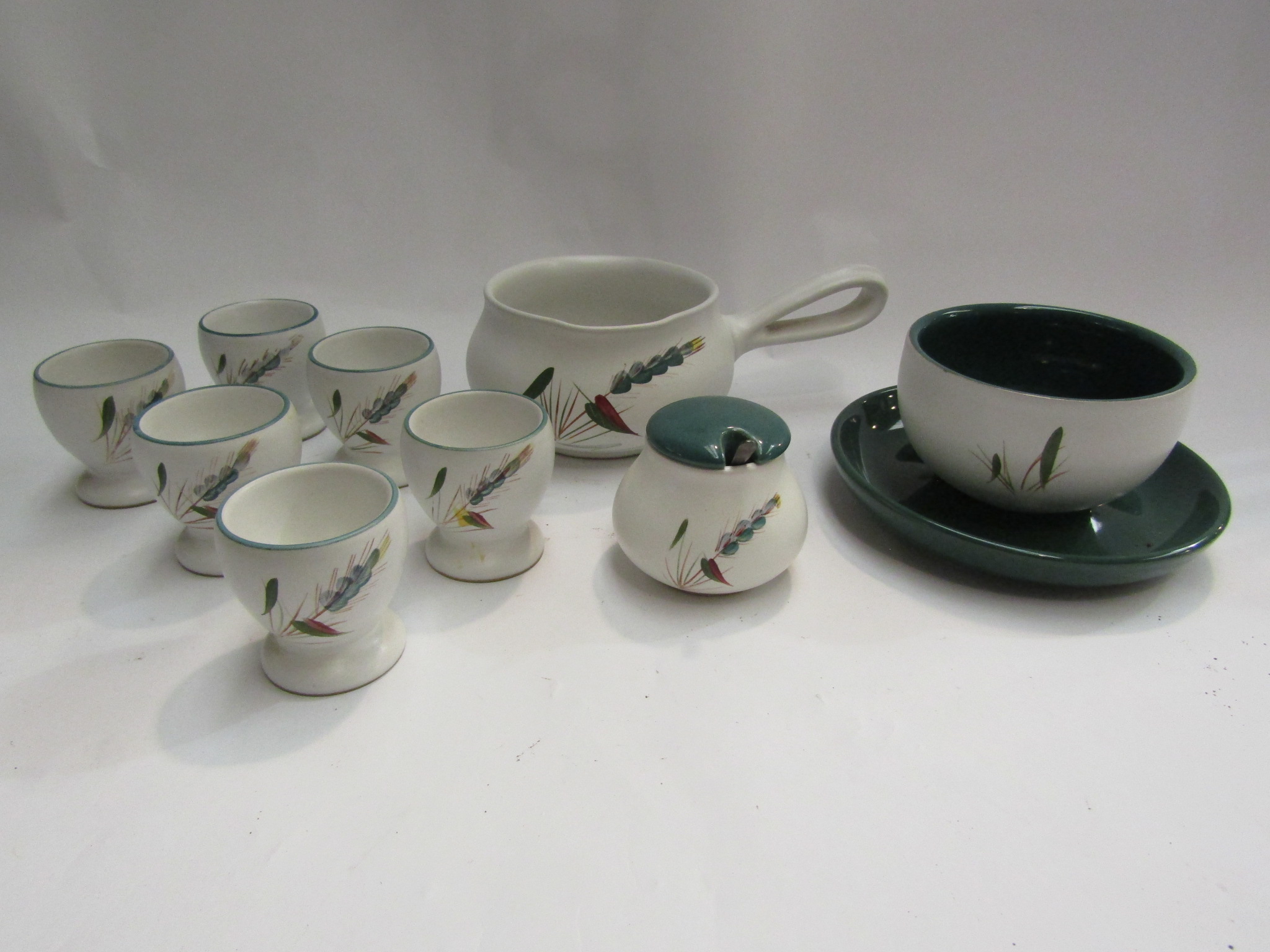 A selection of Denby "Greenwheat" including six egg cups,