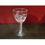 A Georgian wine glass with air twist stem, the bowl engraved with fighting cockerels,