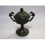 A bronze incense pot in the form of an urn with cover, mask and acanthus leaf to fluted body,