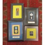 Four framed medal and badge displays including R.M.I.G. 1927 and U.S.A.F.