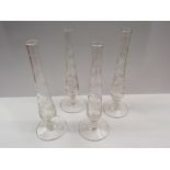 Four 19th Century slender glass stem vases with etched leaf design,