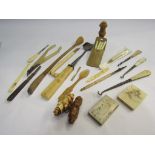 A selection of bone and ivory, resin etc including button hooks and figures,