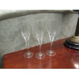 A set of six crystal glass champagne flutes