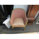 A bygone Lloyd Loom pink tub chair