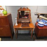 A late Victorian satin walnut dressing table of small proportions with long frieze drawer