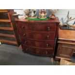 A Victorian crossbanded flame mahogany bow-fronted chest of four drawers,