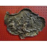 A bronze plaque depicting women hunting with dogs