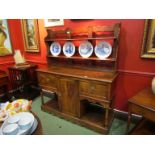 A 19th Century oak Welsh dresser with shaped plate-rack back over two drawer and single cupboard