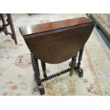 A Victorian Sutherland table with bobbin-turned legs