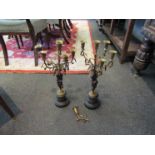 A pair of 19th Century bronze and ormolu candelabra, one sconce detached,