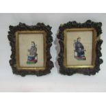 A pair of late 19th Century Chinese portraits on silk in ornate frames,