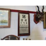 A vintage mahogany cased optician's eye test unit,