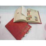 A stamp album and various stamps