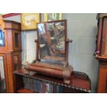 A 19th Century mahogany swing mirror with twin cushion drawers, carved foliate design supports, a/f,