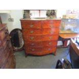 A flame mahogany two over four drawer bow front chest of drawers on bracket feet,