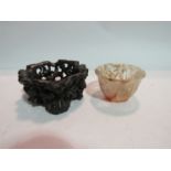 A small Chinese carved crystal bowl and hardwood stand