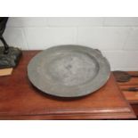 A large 18th Century pewter charger stamped Bowood,