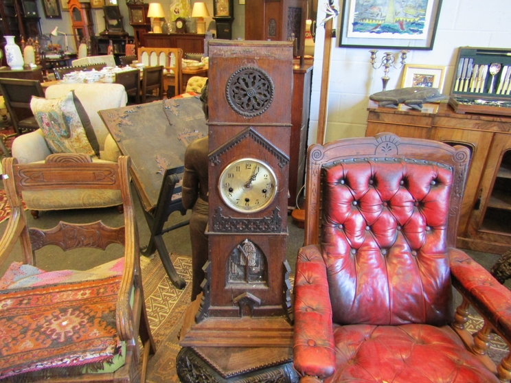 A Gothic oak ecclesiastical carved clock with chime mechanisms