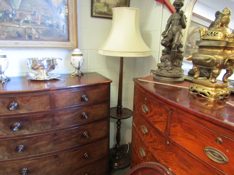A mahogany lamp standard with dished rim circular table and shade