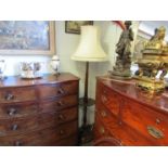 A mahogany lamp standard with dished rim circular table and shade