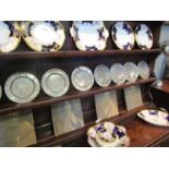 A set of eight circa 18th Century heavy pewter plates. All stamped P F to front. 17.