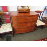 A mid Victorian flame mahogany bow front chest of three graduating long drawers on bracket feet,