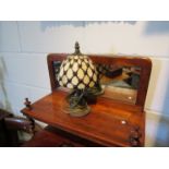 A small Tiffany style lamp,