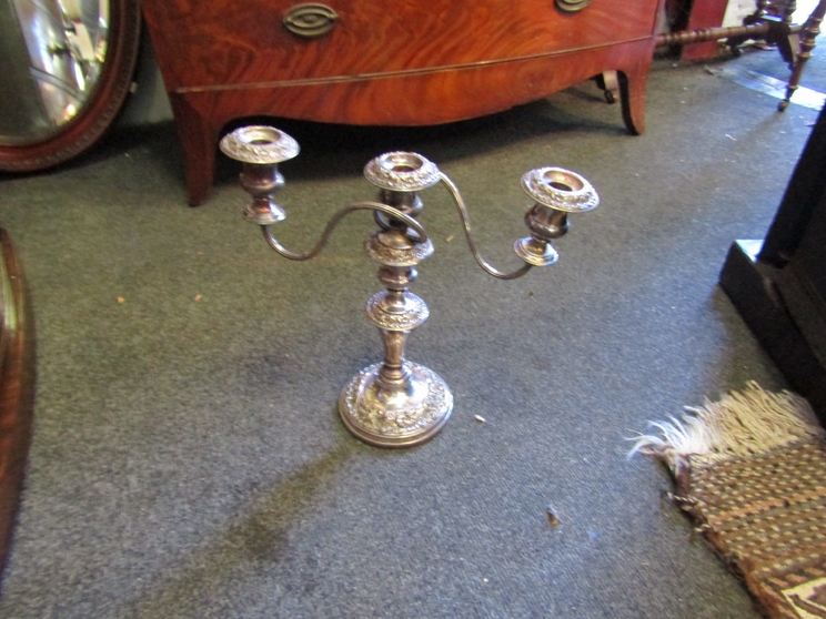 A pair of silverplate on copper candelabra's,