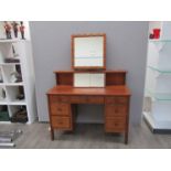 A Heals dressing table, twin pedestal with seven drawers,