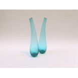 A pair of Italian glass free form vases in turquoise coloured glass. Dolphin moulded pontil to one.
