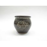 A Leach Pottery St Ives pot with ash glaze, oak leaf design. Pottery seal only. 8.