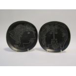 Two relief moulded plates by Stig Lindberg for Gustavsberg with black glazed, unmarked,