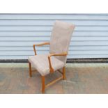 A Danish 1940s high back chair with stained beech arms and rounded square legs,