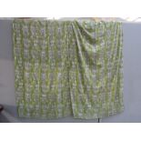 A pair of 1950's curtains, green ground with white stylised flowers.