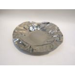 An Alessi dish, 2001 stainless steel,