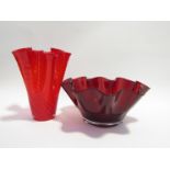 An art glass handkerchief vase in red with wrythen body,