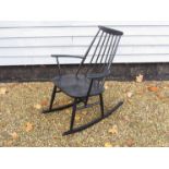 A mid 20th Century black painted rocker in the Scandinavian style.