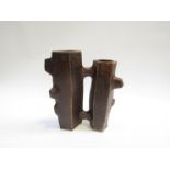 A studio ceramic 'Brutalist' vases joined as one, dark treacle glaze. Unmarked 23cm high.